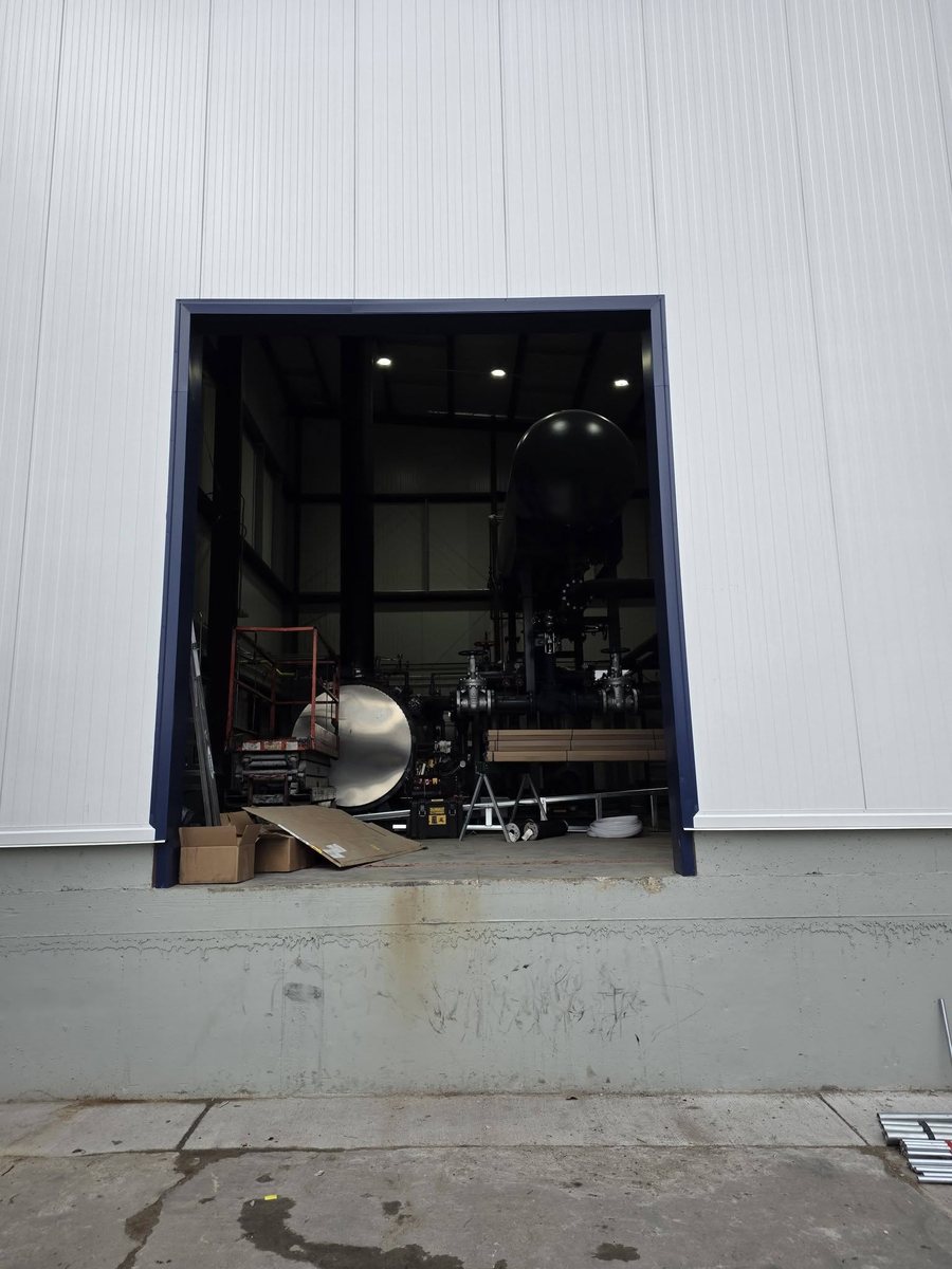 Commercial building with open doorway before garage door installation Kansas City