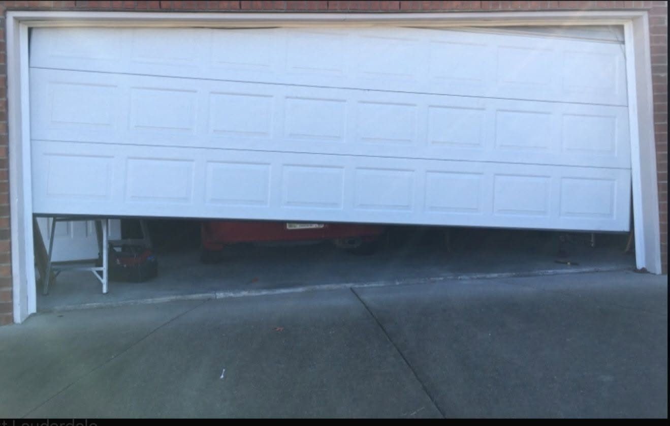 Garage door jammed at an angle before an off-track repair