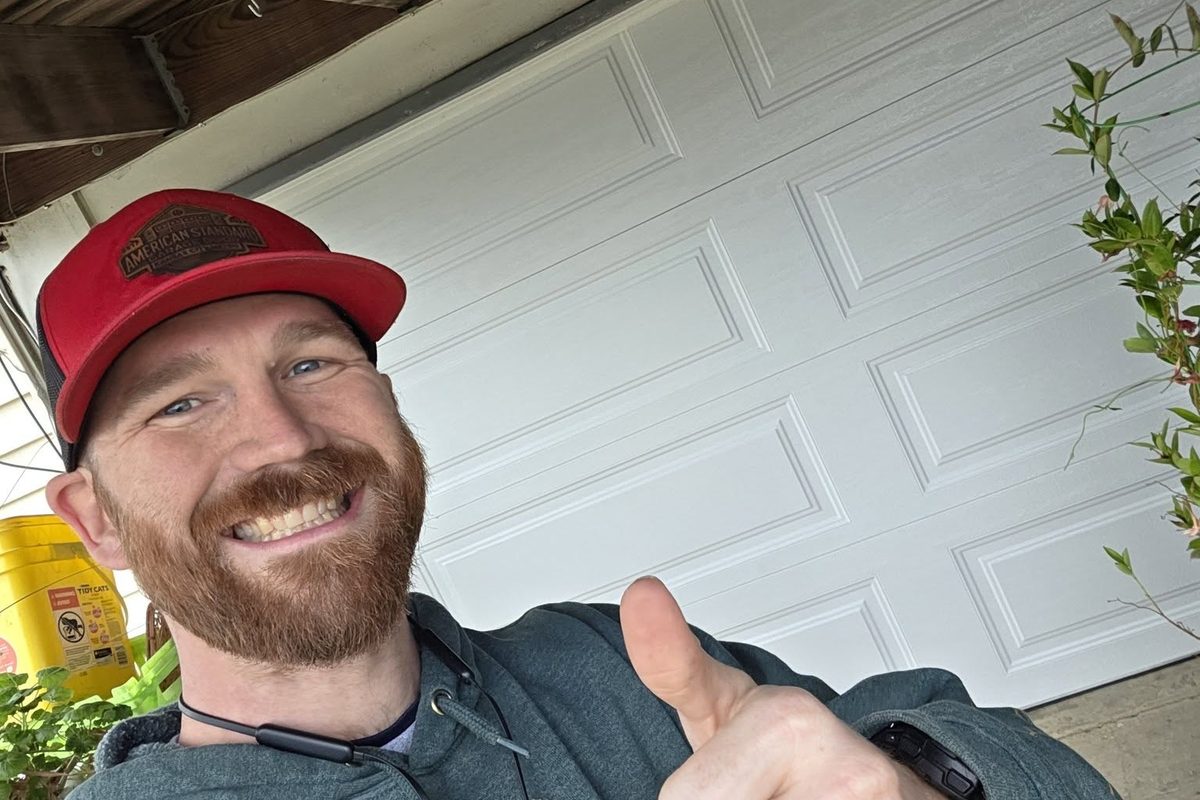 Zach Wallace, owner of American Standard Garage Door, on a service call